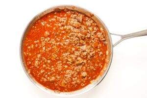 Meat sauce for Beef Enchilada Nachos in a skillet.