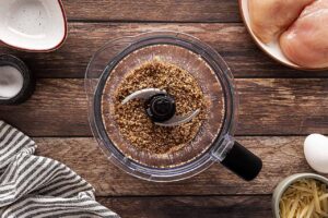Blended breading in a blender tumbler.