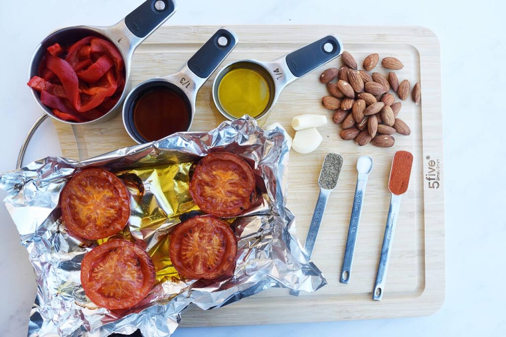 Ingredients for this Romesco Sauce Recipe collected on a cutting board.