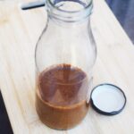 An open jar holds a batch of Worcestershire Sauce Substitute.