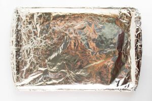 Foiled-lined baking pan. Overhead focus.