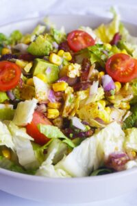 Front view of a Loaded Bacon Salad in a white bowl.
