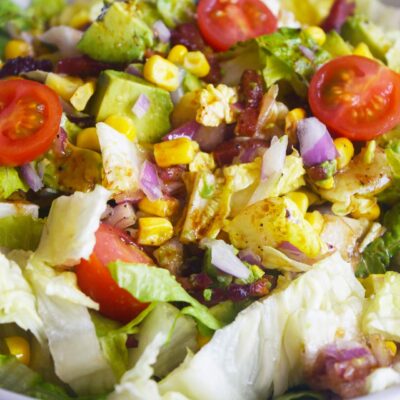 Front view of a Loaded Bacon Salad in a white bowl.