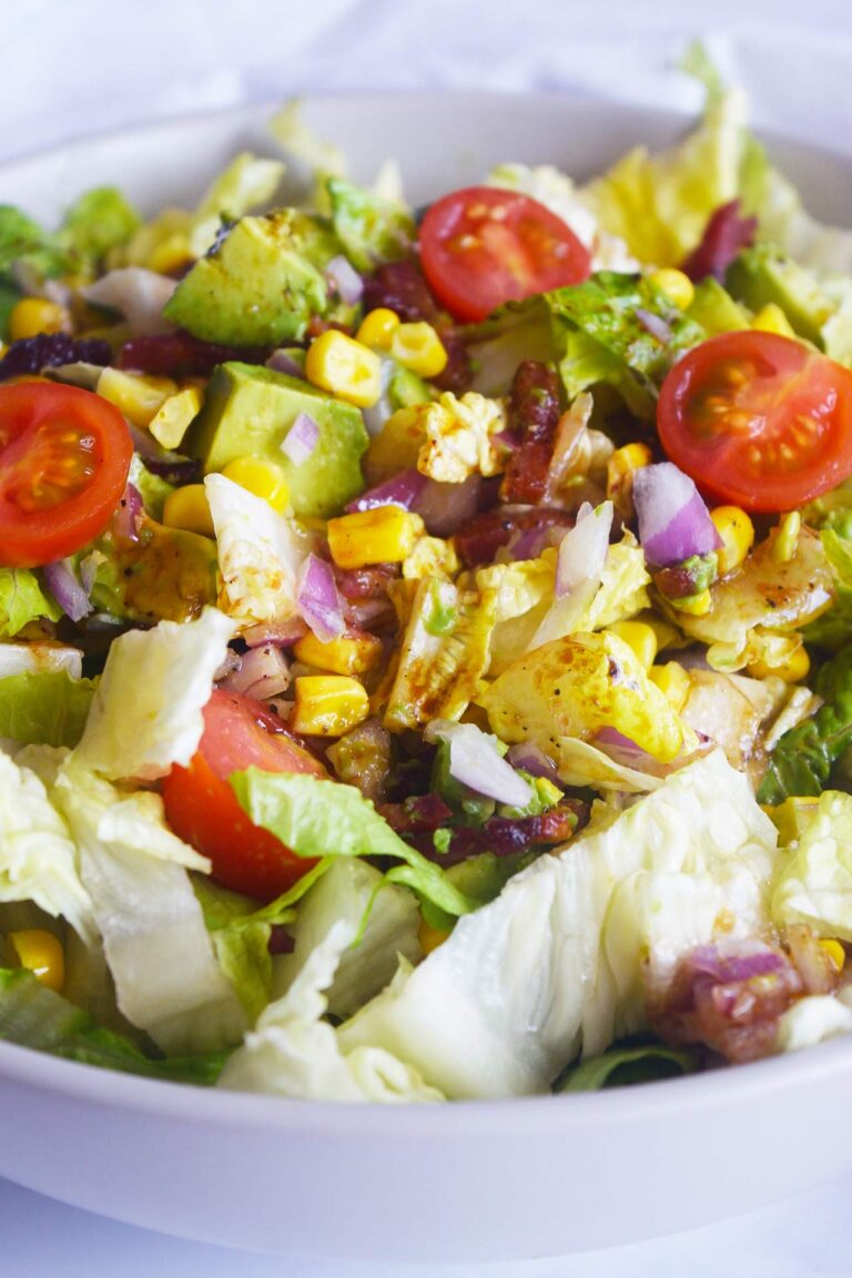 Front view of a Loaded Bacon Salad in a white bowl.
