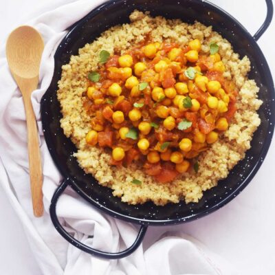 Overhead focus. Moroccan Chickpea Stew served over quinoa.