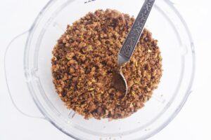 Overhead view of Pangrattato in a glass bowl with a spoon.