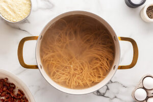 Cooked pasta in pasta water.