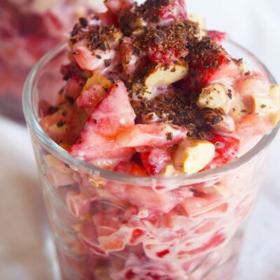 Two cups filled with Strawberry Salad on a white background.