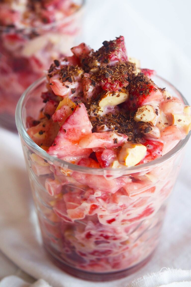 Two cups filled with Strawberry Salad on a white background.