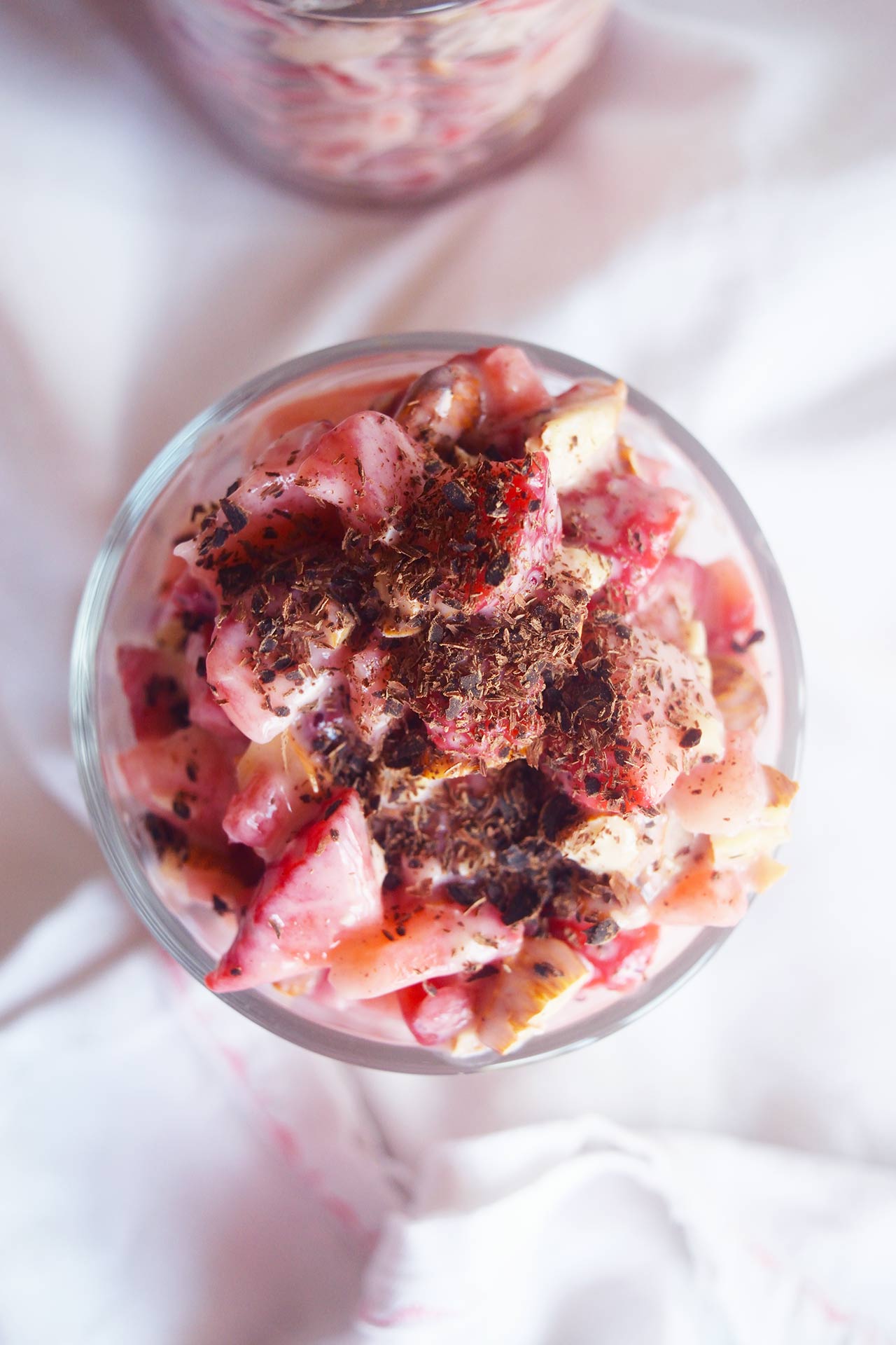 Overhead view of a cup of Strawberry Salad garnished with chocolate shavings.