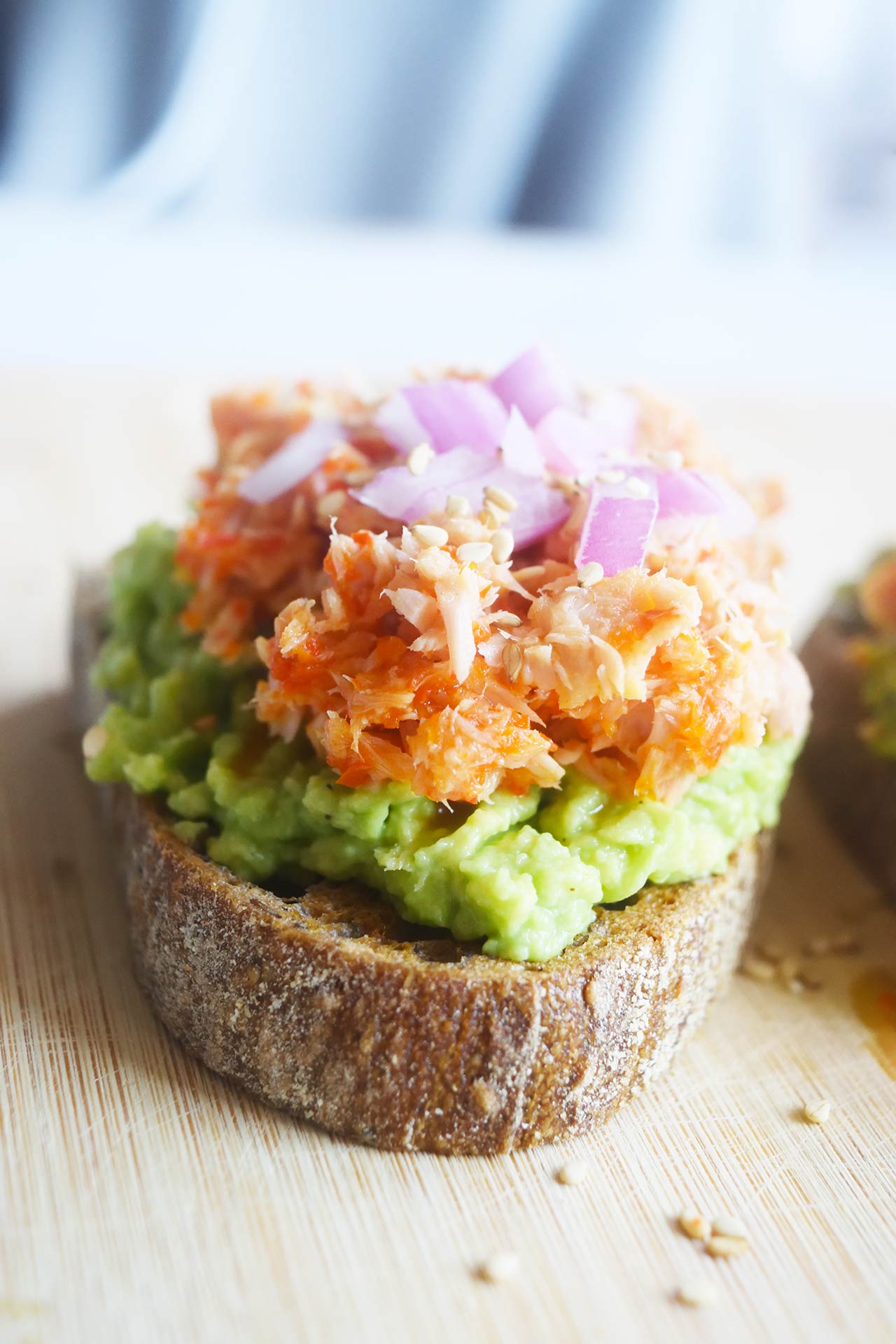 Front focus on heel end of tuna avocado toast.
