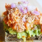 Closeup of a slice of tuna avocado toast.