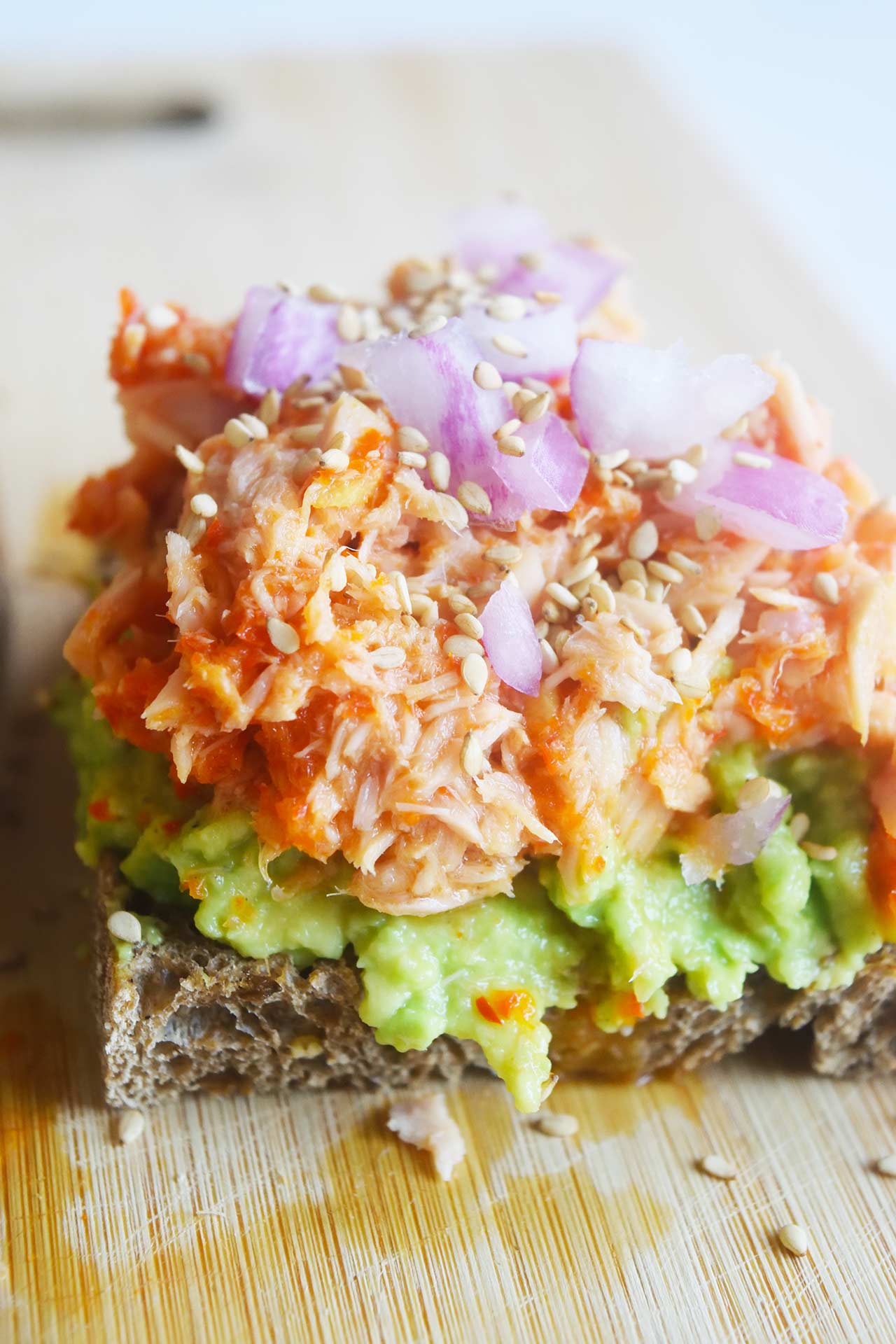 Closeup of a slice of tuna avocado toast.