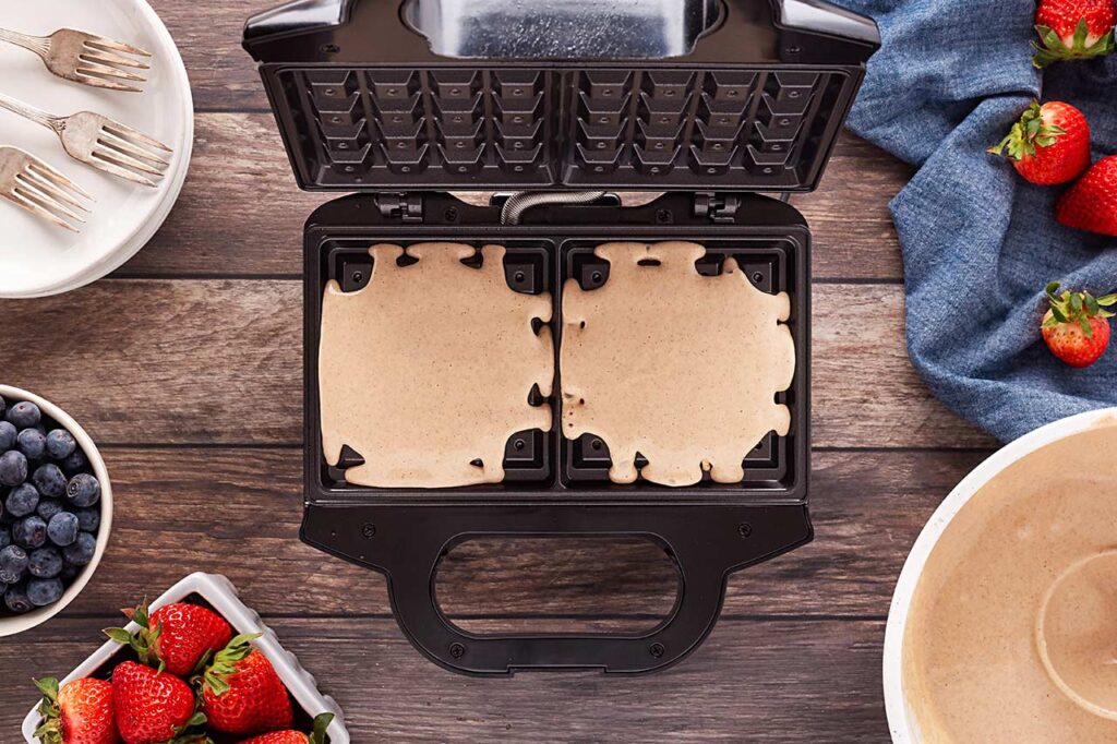 Batter poured onto a waffle maker.