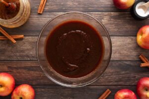 Strained apple butter in a glass bowl.