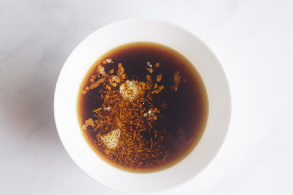 Marinade for chicken in a white bowl.