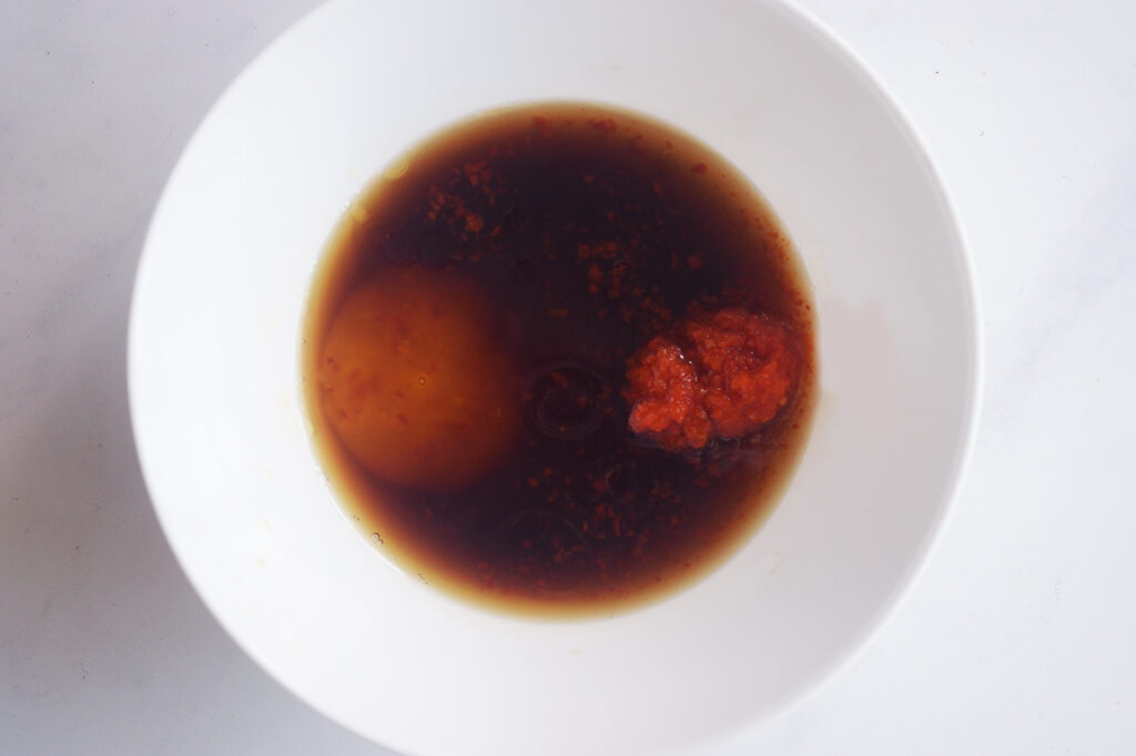 Dressing ingredients in a white bowl.