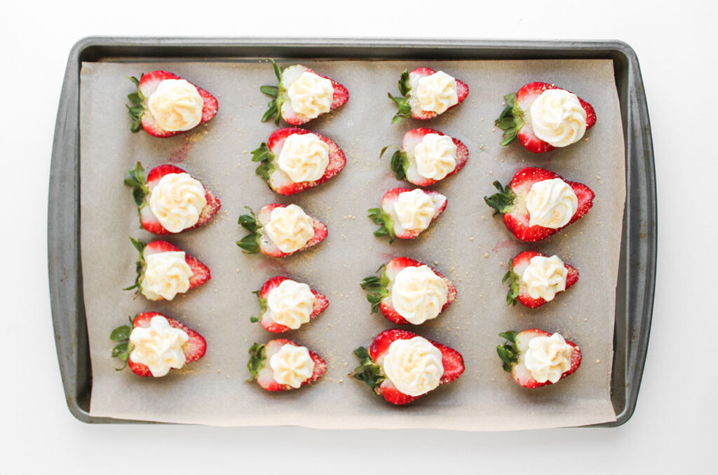 Deviled Strawberries topped with honey-sweetened graham cracker crumbs.