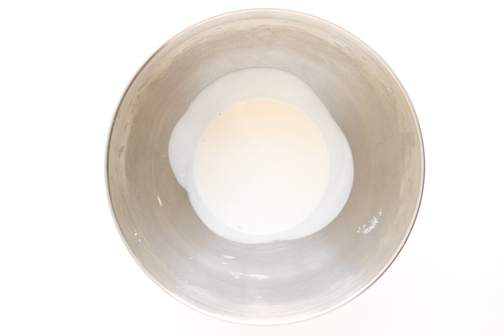 Heavy cream in a mixing bowl.