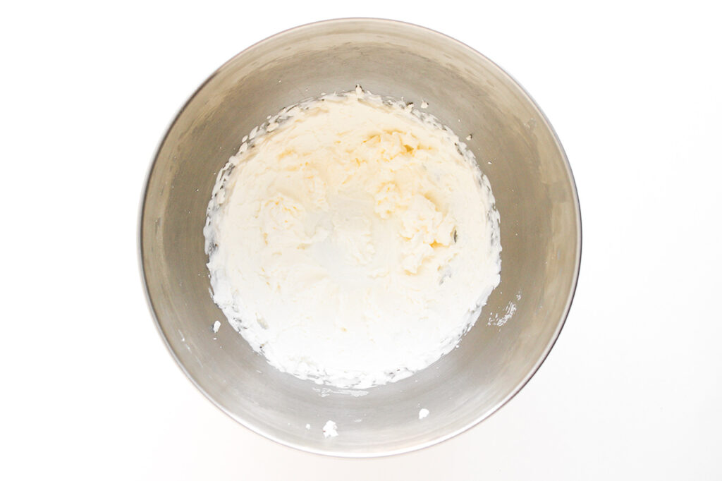 Blended whipped cream in a mixing bowl.