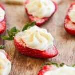 Deviled Strawberries on a cutting board.