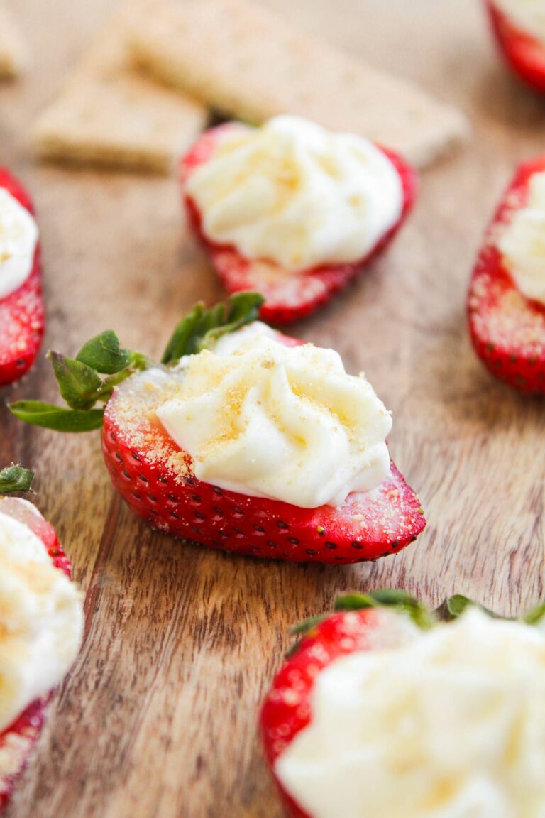 Deviled Strawberries on a cutting board.