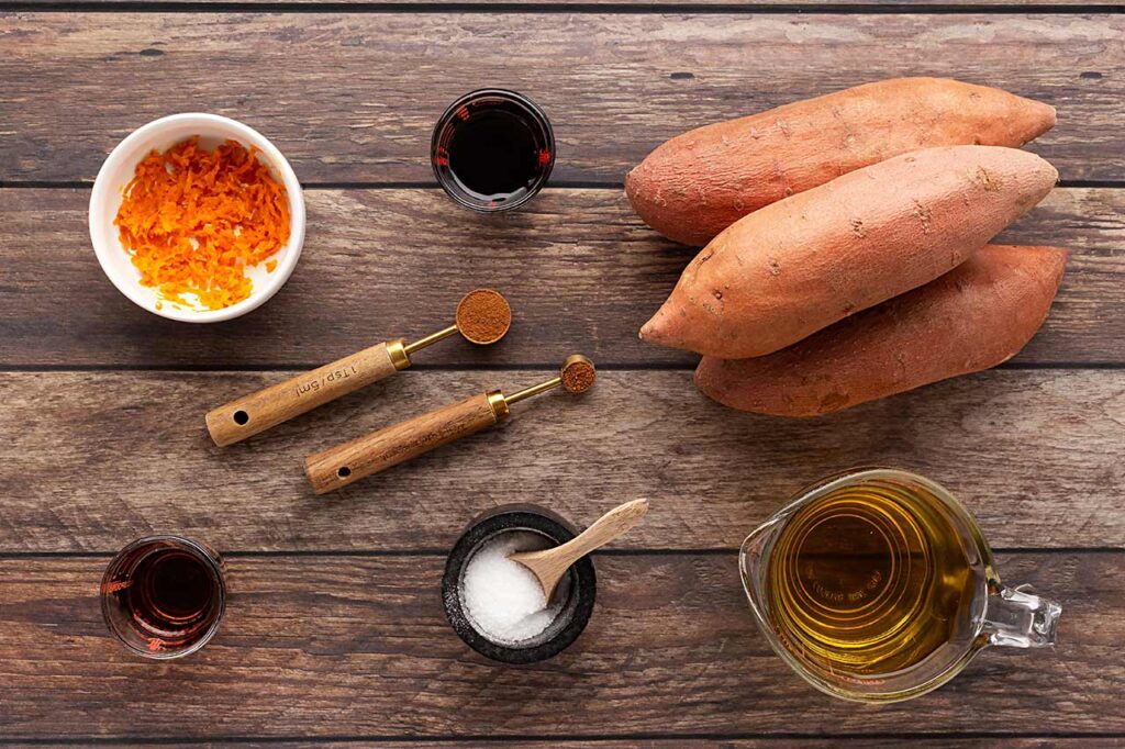 Ingredients for Sweet Potato Butter on a wood surface.