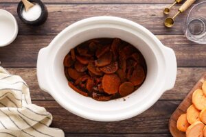 Cooked Sweet Potato Butter ingredients in a slow cooker crock. Overhead view.