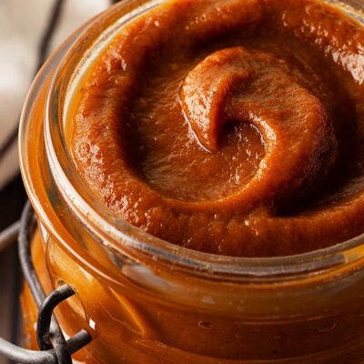 Closeup front view of an open jar of Sweet Potato Butter.