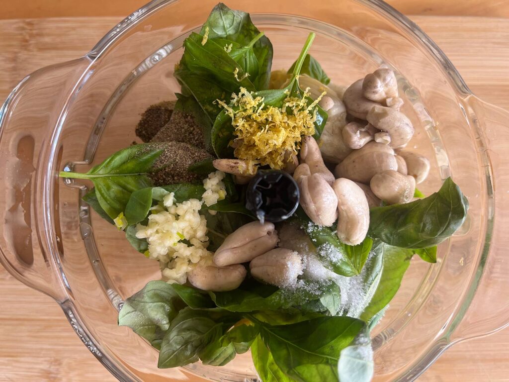 Artichoke Pesto ingredients in a food processor, unblended.