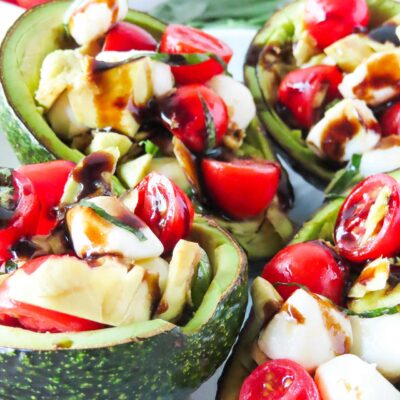 Closeup of several Caprese Stuffed Avocados.