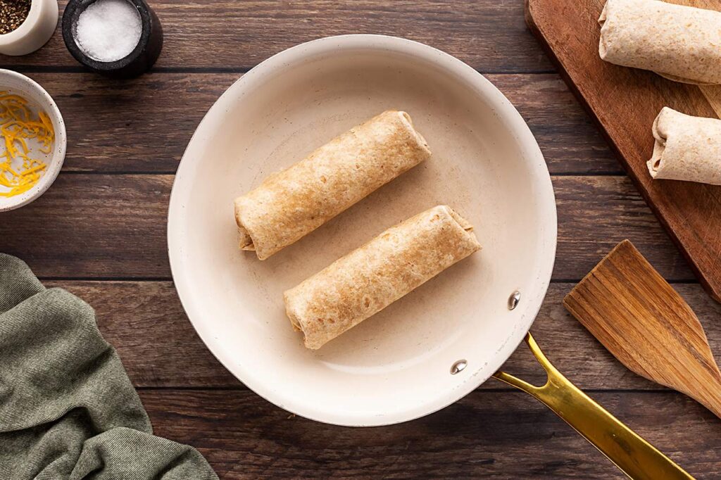 Two Healthy Breakfast Burritos in a skillet.
