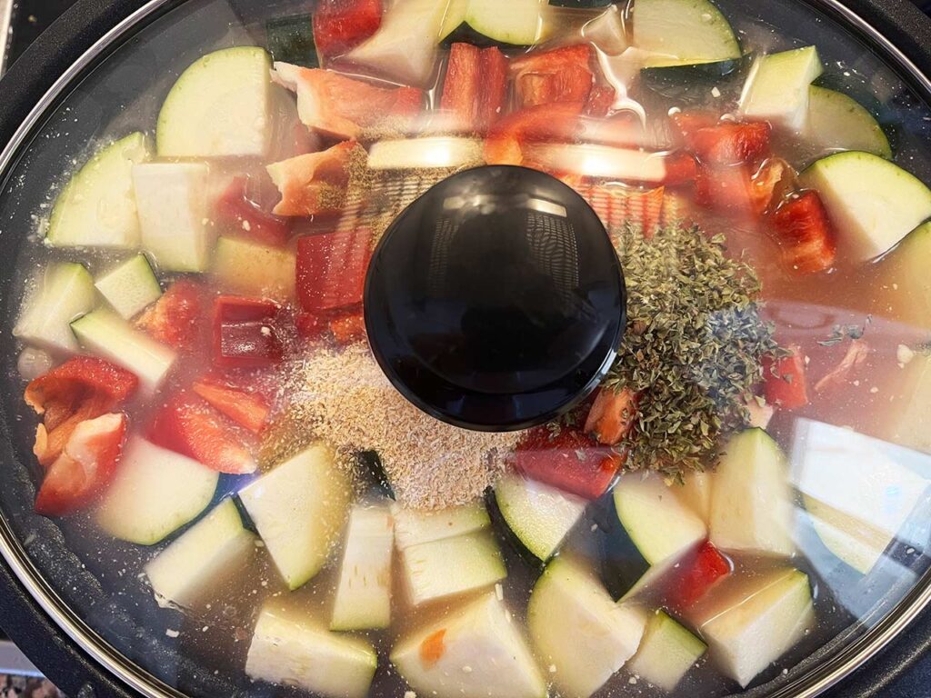 A lid placed on a full slow cooker crock.