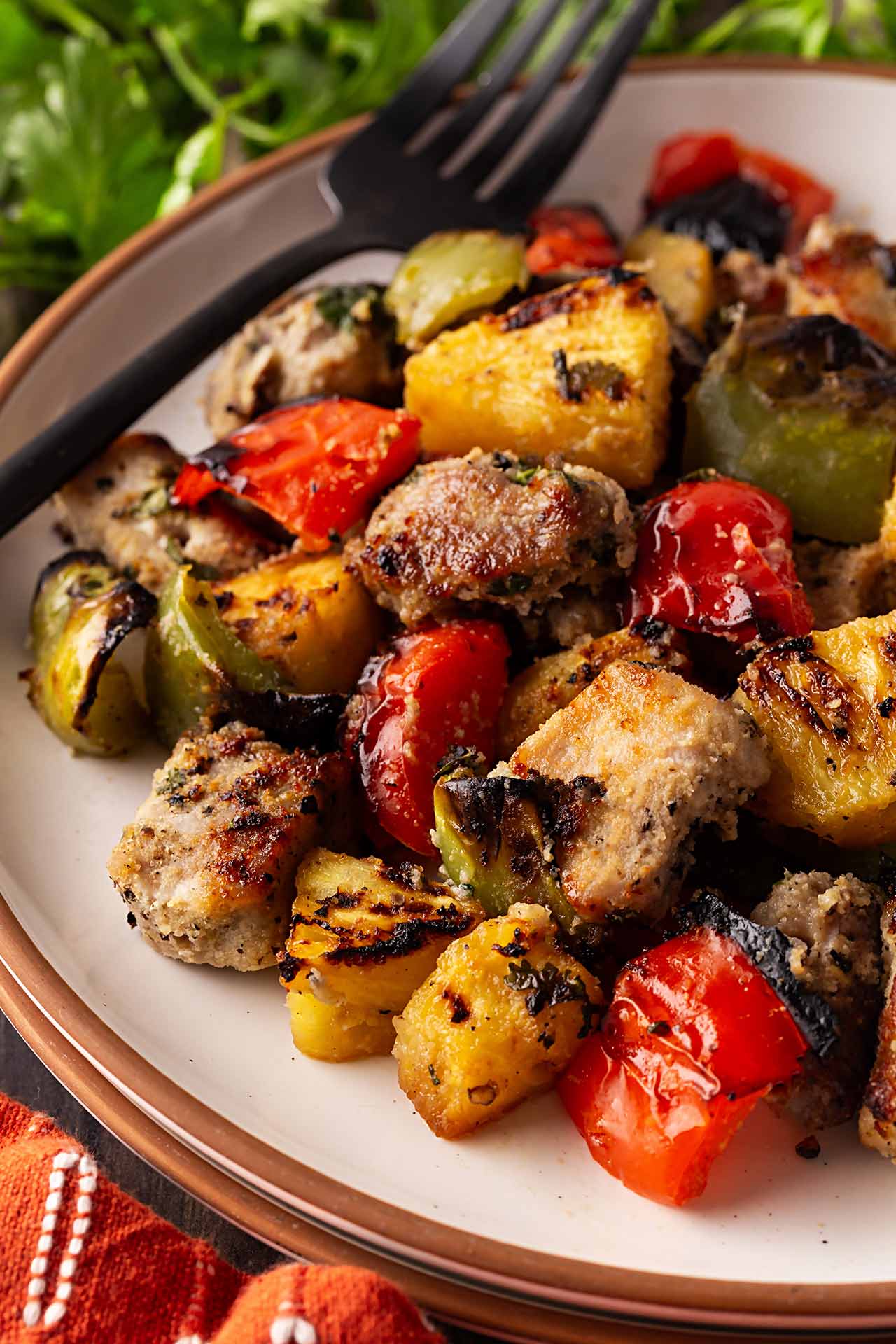 Pork Kabobs removed from skewers. Chunks of pork, pineapple and peppers on a plate.