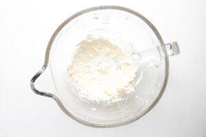 Whipped cream cheese in a glass bowl.