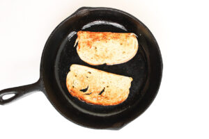 Two slices of bread in a skillet.