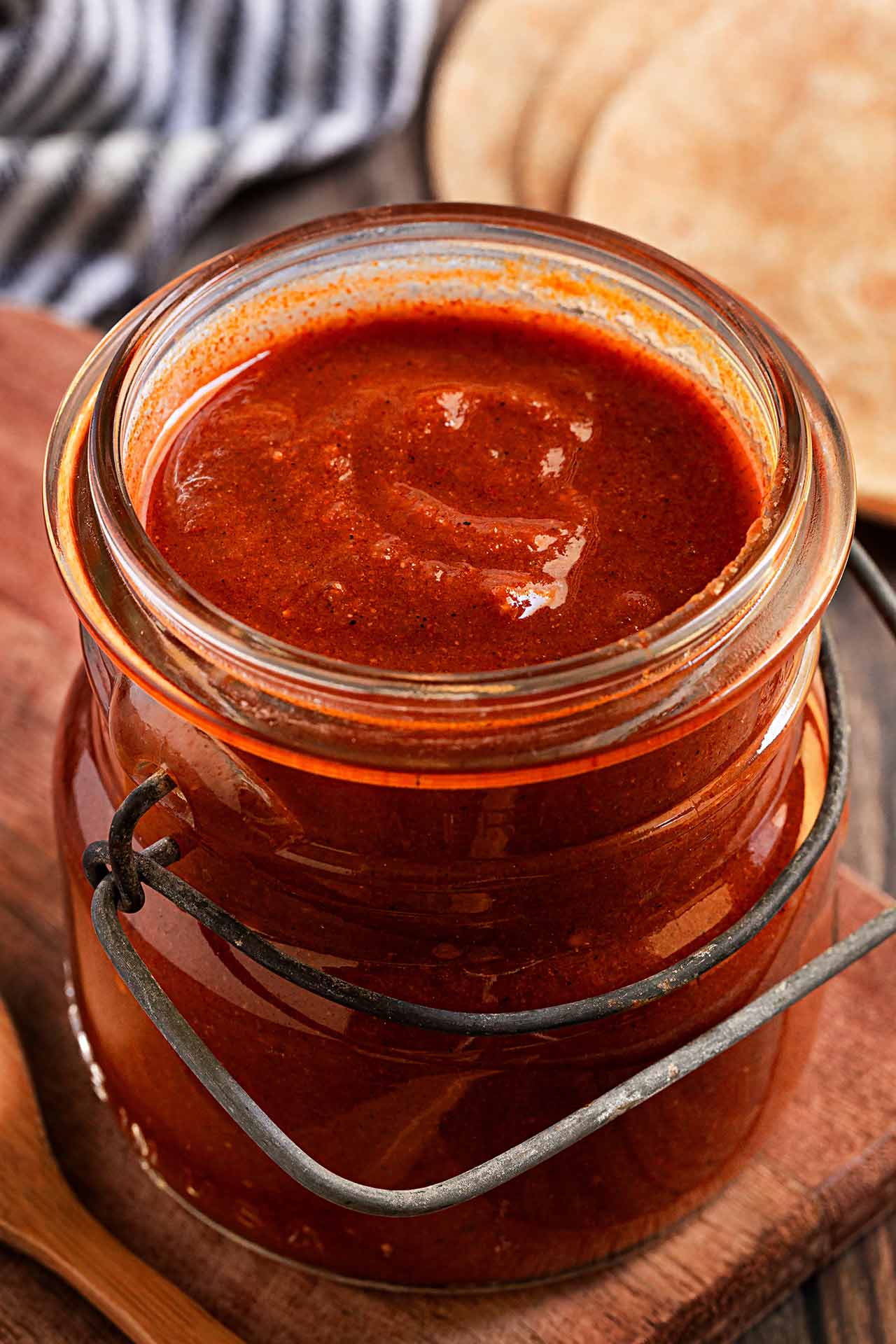 An open canning jar full of Enchilada Sauce.