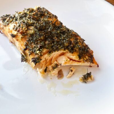 Front view of a partially eaten salmon fillet.