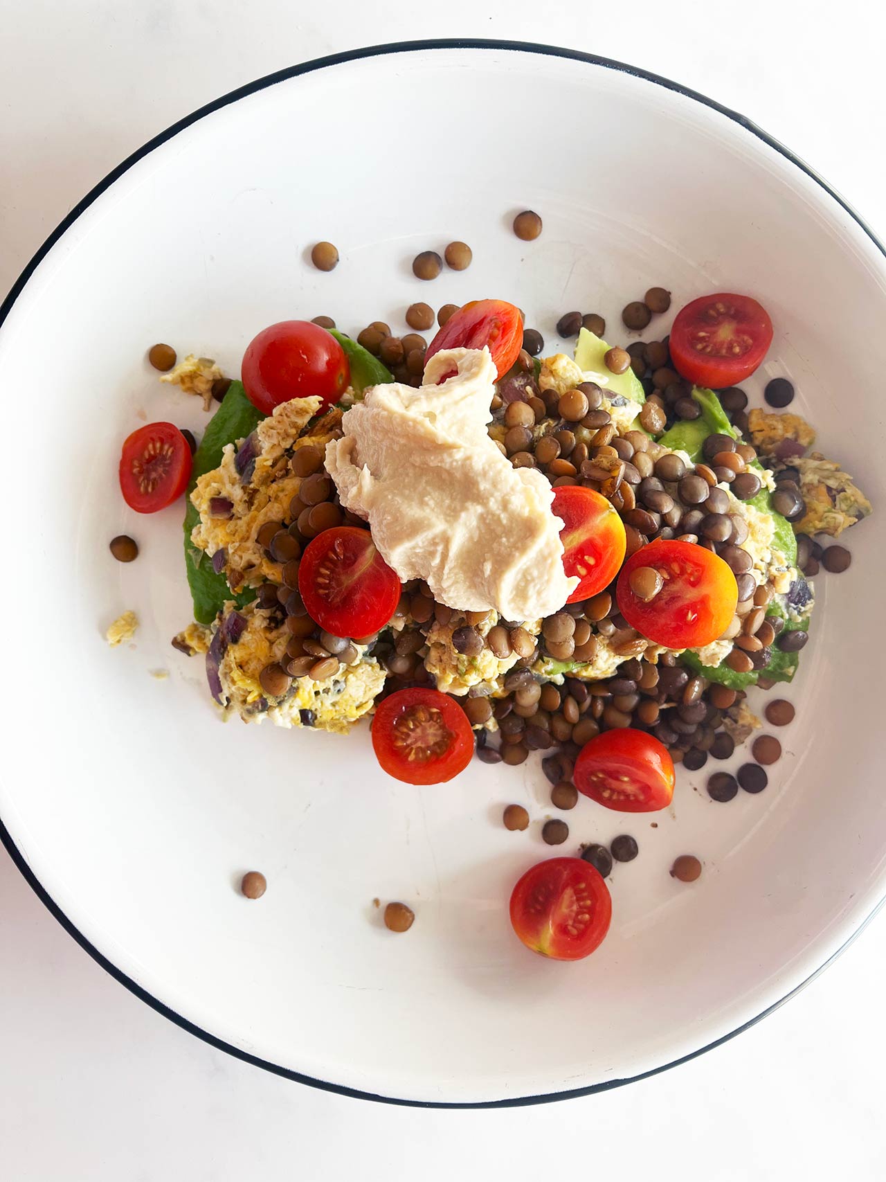 Overhead view of a plate with a finished Mediterranean Omelette on it.