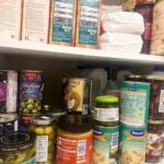 A pantry stocked with pantry staples.