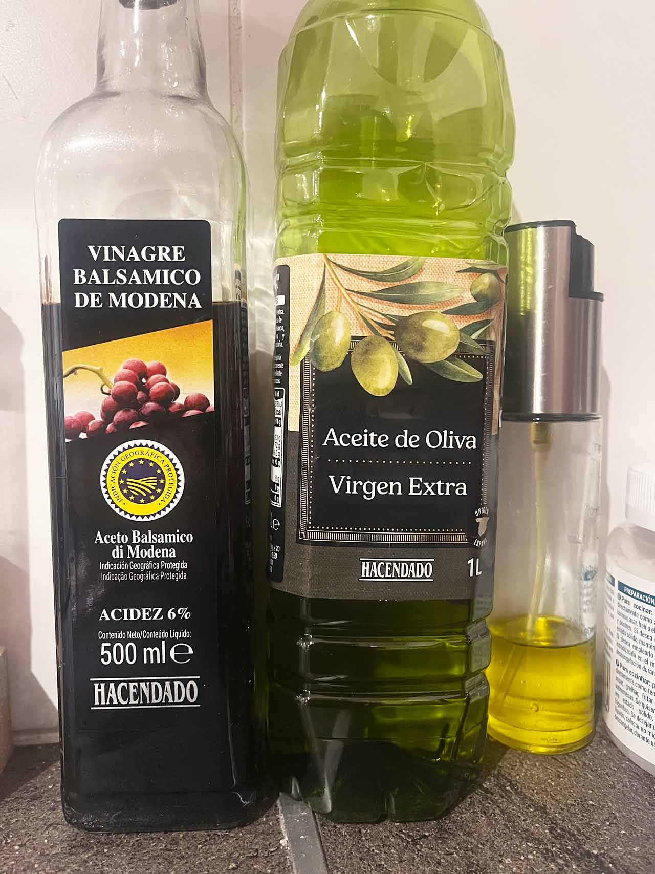 Oil and vinegar against a white background.