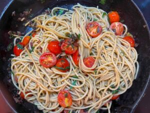 Tossed Easy Italian Tomato Pasta in a skillet.