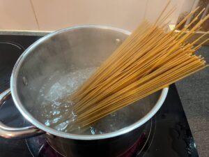 Boiling pasta in salted water.
