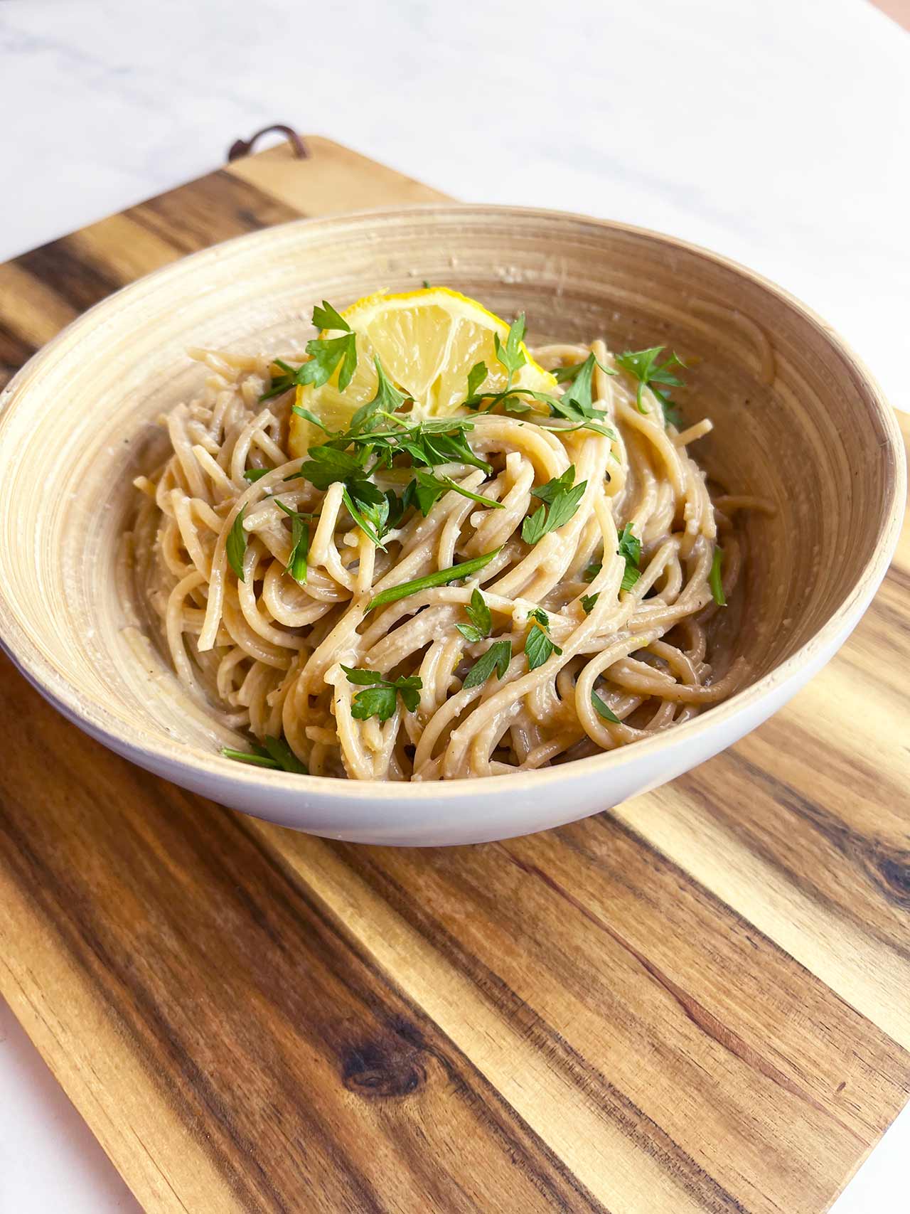 Front view of a bowl of lemon pasta.