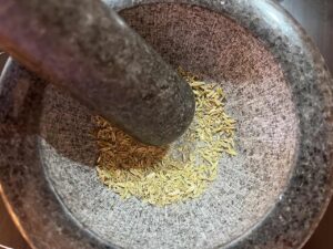 Mashing the fennel seed in this Copycat Trader Joe's Pizza Seasoning.