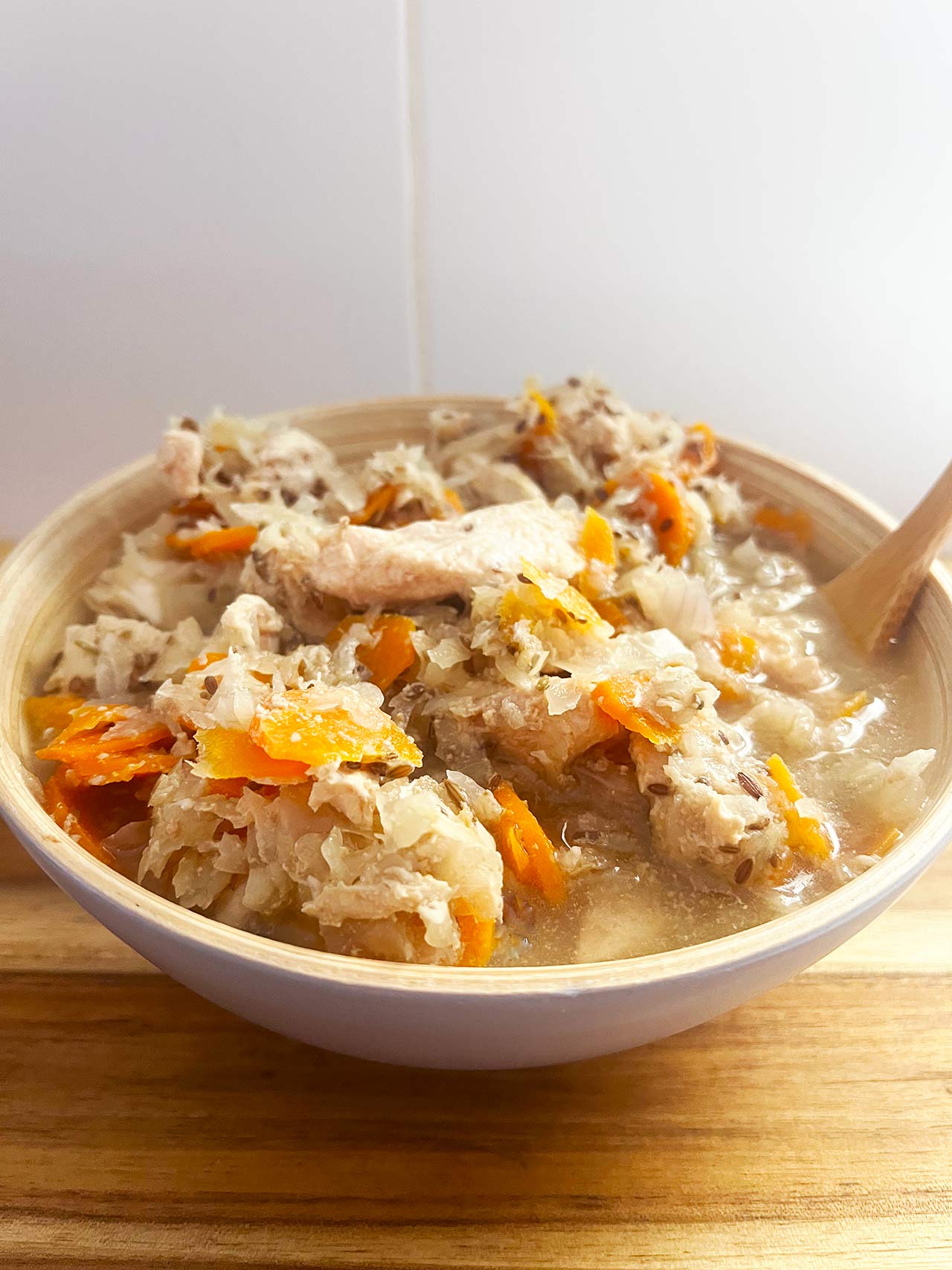 Front view of a full bowl of Slow Cooker Chicken And Cabbage.