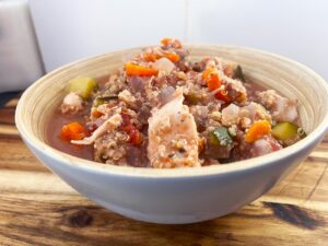 Front view of a bowl filled with Slow Cooker Chicken And Quinoa Stew.