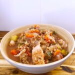 Front angled view. A bowl full of Slow Cooker Chicken And Quinoa Stew.
