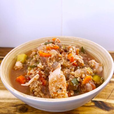 Front angled view. A bowl full of Slow Cooker Chicken And Quinoa Stew.