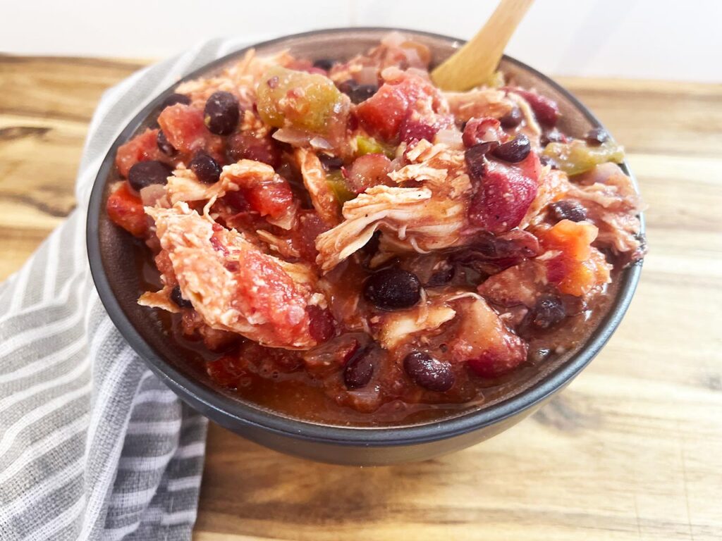Front view of a bowl filled with Slow Cooker Chicken Taco Stew.
